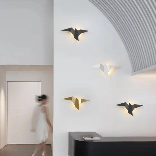 Bird wall lamps in white, gold, and black